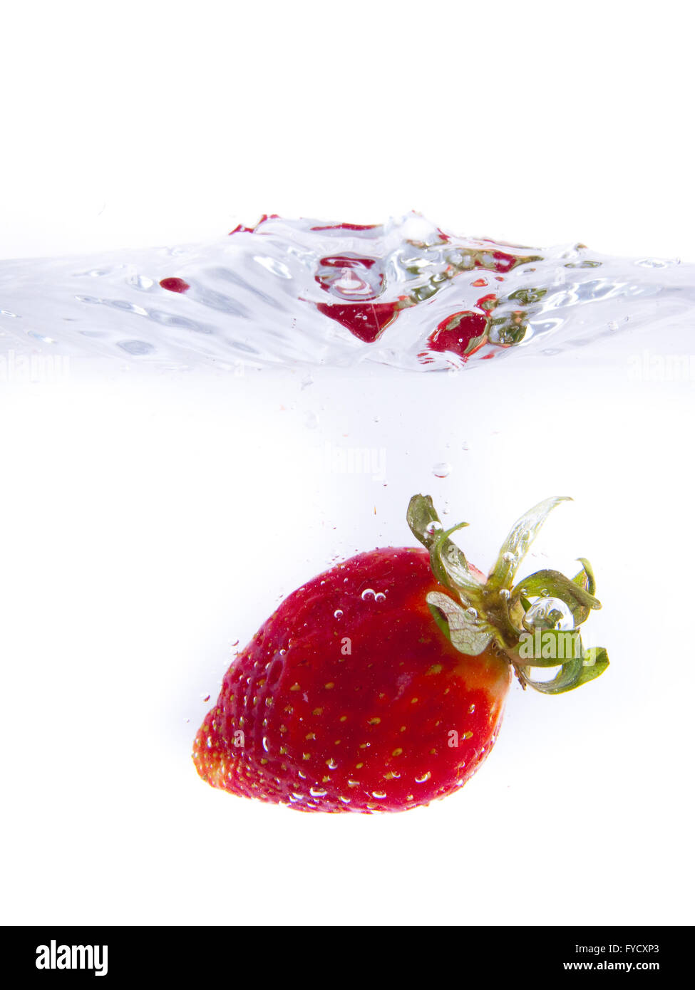 Fruits falling into the water Stock Photo