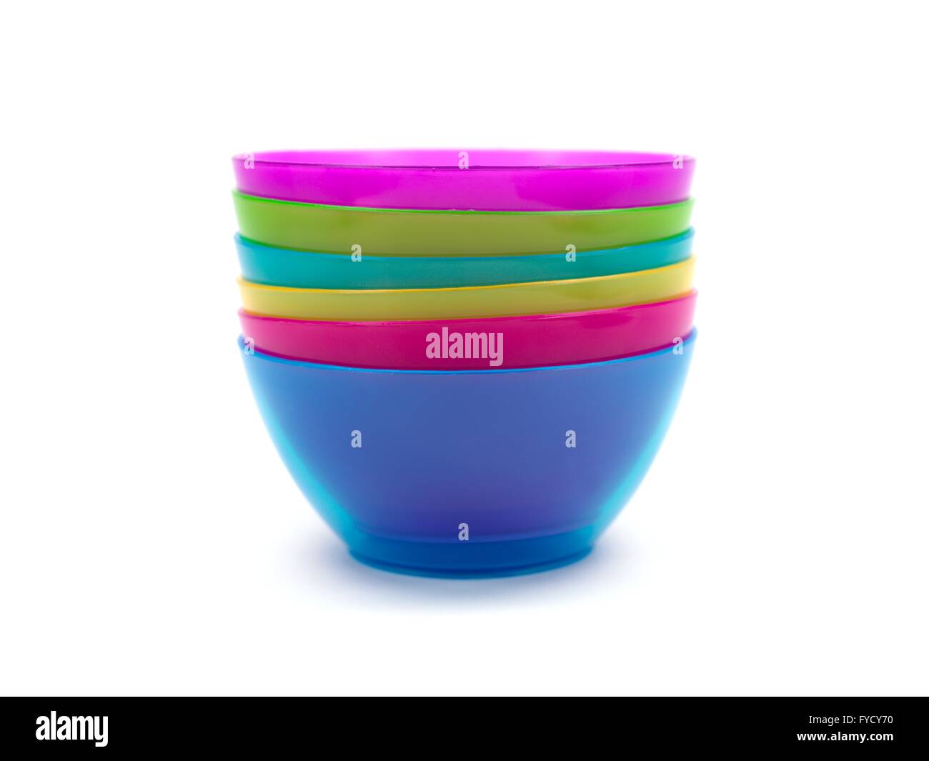 A stack of plastic bowls isolated against a white background Stock Photo