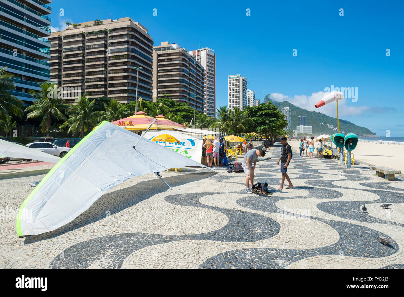 RIO DE JANEIRO - MARCH 19, 2016: Hanggliders wait for dismantling beside the beach at Sao Conrado. Stock Photo