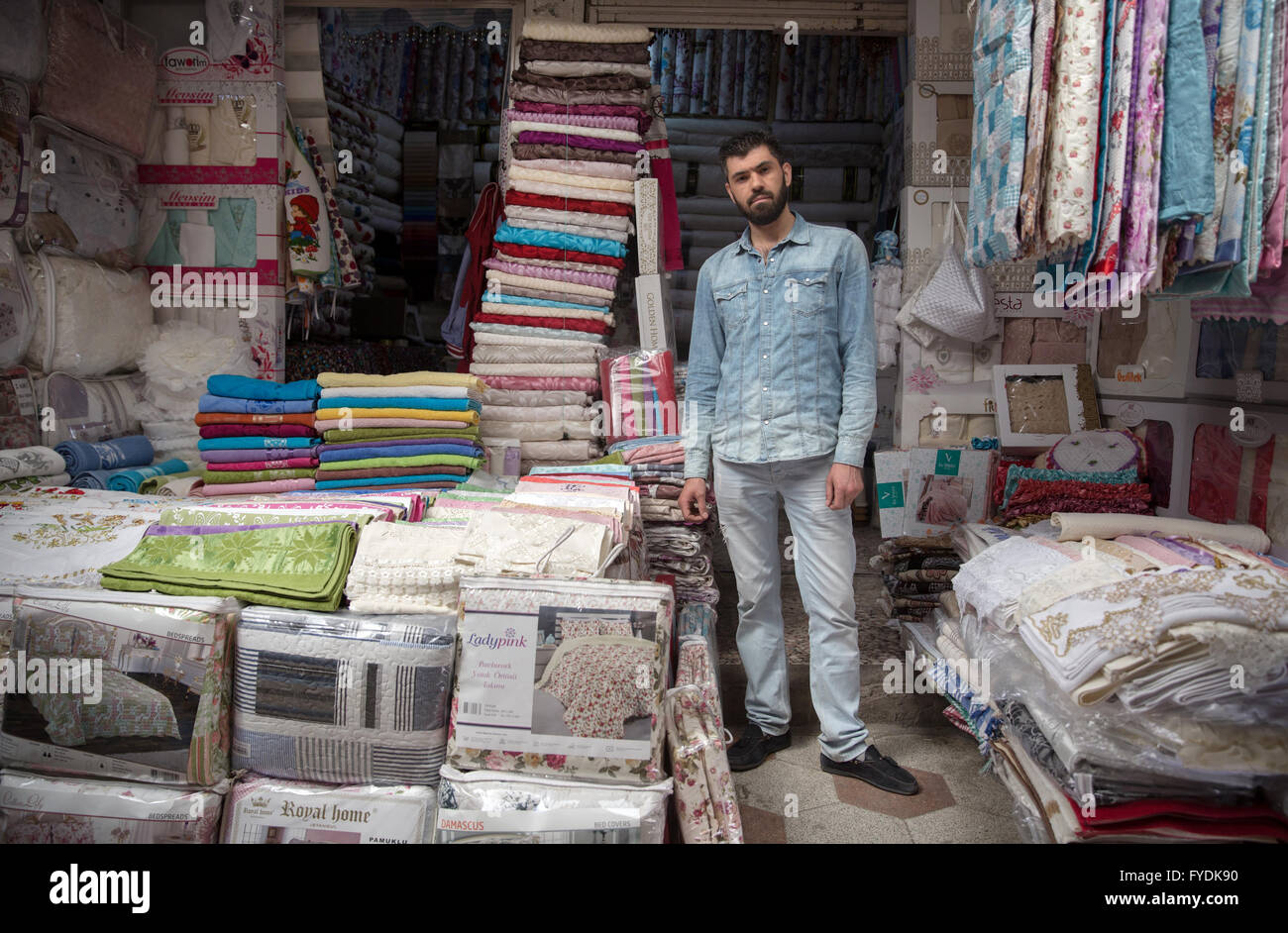 Kilis, Turkey. 22nd Apr, 2016. Portrait of a turkish textile shop owner Ali Yeminicioglu (35) whos doing business with syrians in his shop in Kilis, Turkey, 22 April 2016. Tens of thousands of Syrian refugees are living in Kilis. Foto: Uygar Onder Simsek/dpa/Alamy Live News Stock Photo