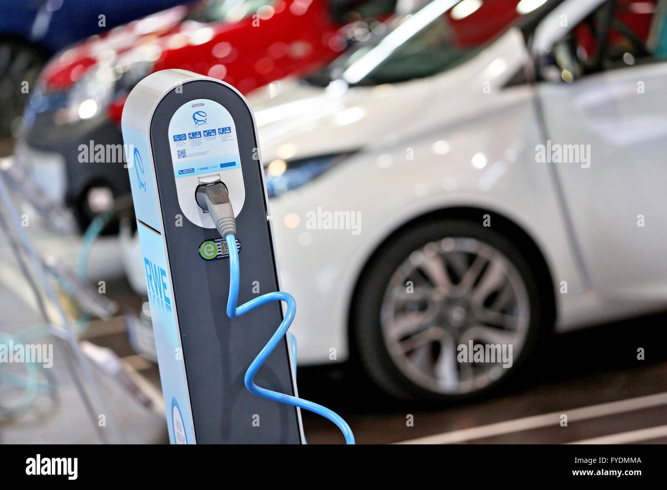 A Renault ZOE Z.E. at a charging pole in an exhibition hall during a conference for electromobility in Leipzig (Saxony), Germany, 14 April 2016. The series vehicle is powered by an electric motor with 88 hp. Photo: Jan Woitas/dpa Stock Photo