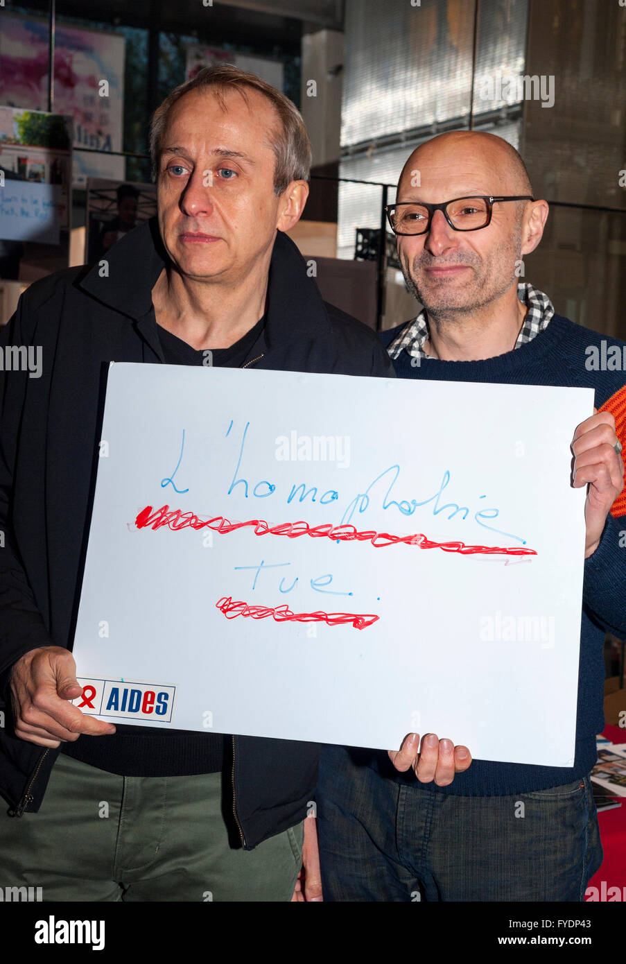Montreuil, France, Olivier Ducastel  and Jacques Martineau, French Filmmakers at Presentation of New Gay AIDS Theme Film, "Théo & Hugo in the Same Boat" at the Mé-lies Cinema, Holding Protest SIgn "Homophobia Kills" Stock Photo