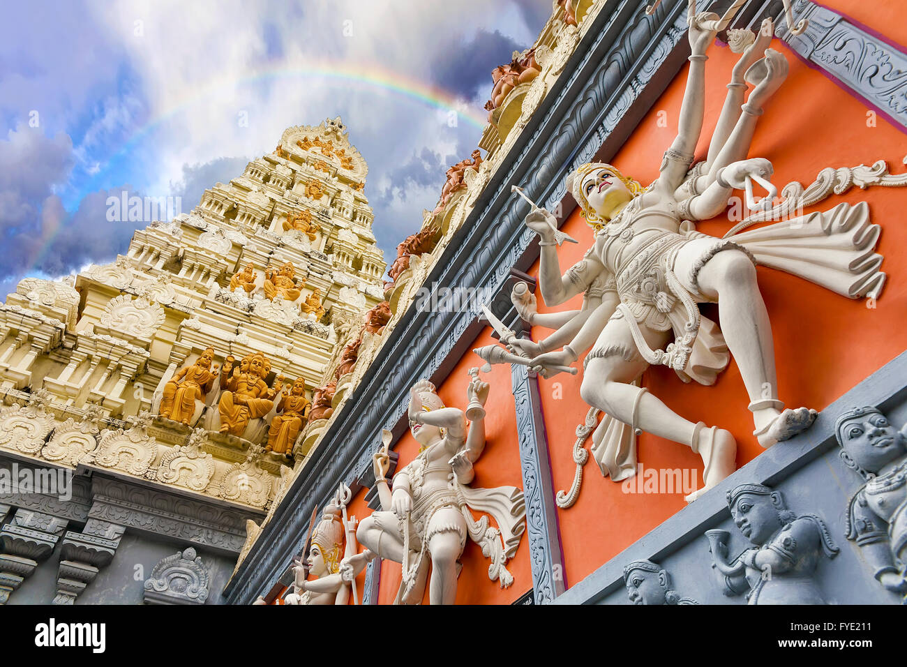 Rainbow Over Dravidian Architecture Exterior of Sri Senpaga Vinayagar Hindu Temple in Singapore Stock Photo