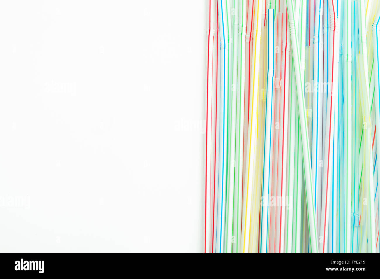 Detail of group of colorful drinking straws with isolated background Stock Photo