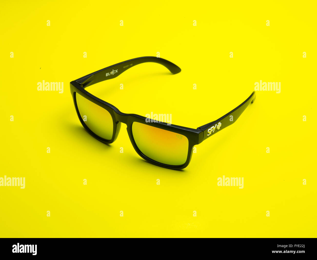 Close up detail of a pair of Spy Optics Sunglasses with Yellow Lenses Stock Photo