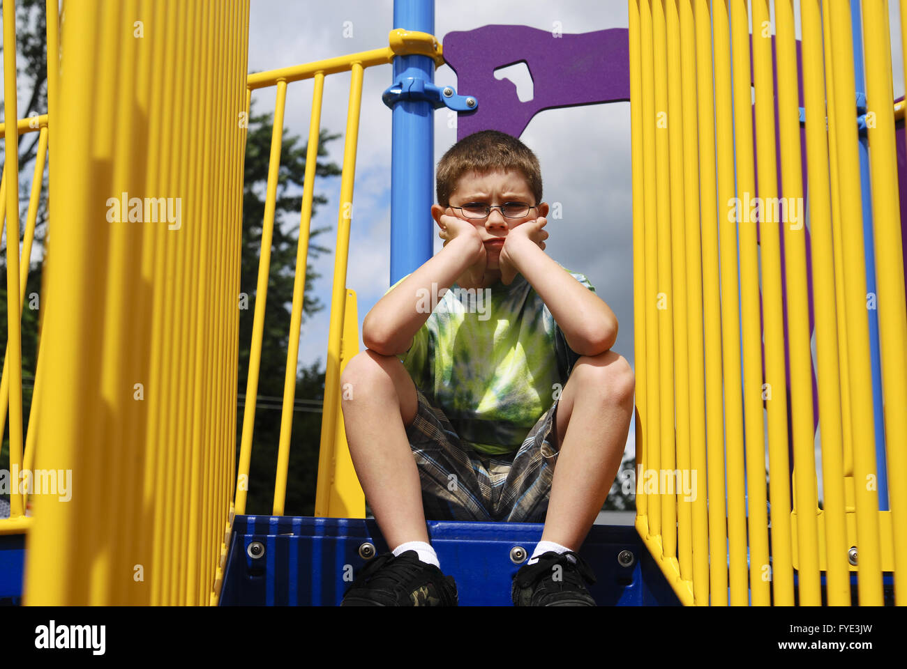 Young boy at the playground Stock Photo - Alamy