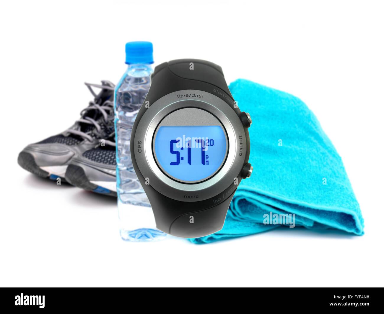 A sports watch isolated against a bottle of water Stock Photo