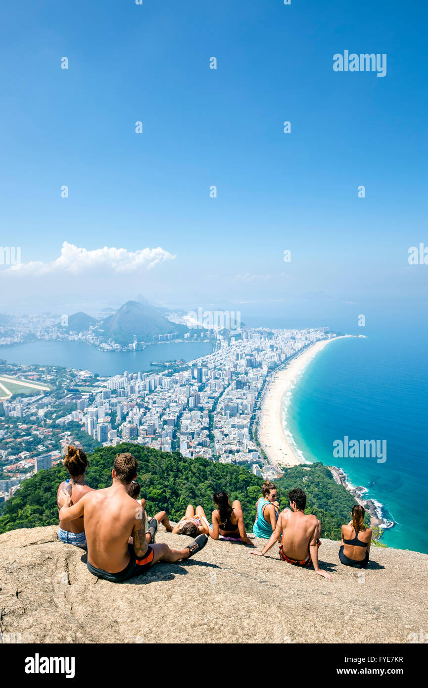 RIO DE JANEIRO - MARCH 9, 2016: Visitors take in the view of the city skyline after a hike to the top of Two Brothers Mountain. Stock Photo