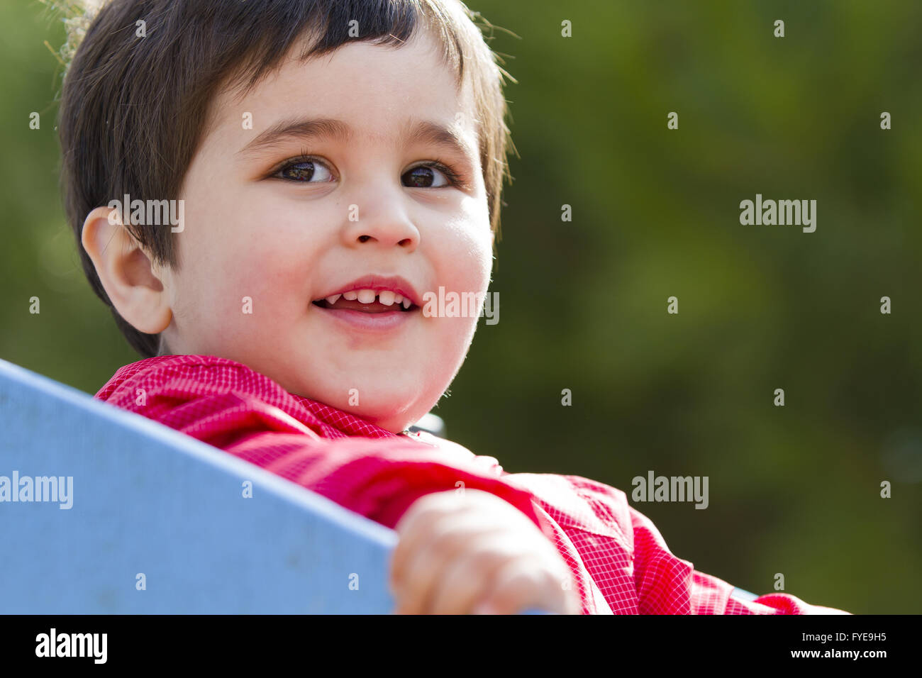 Cute little european baby boy playing at park Stock Photo