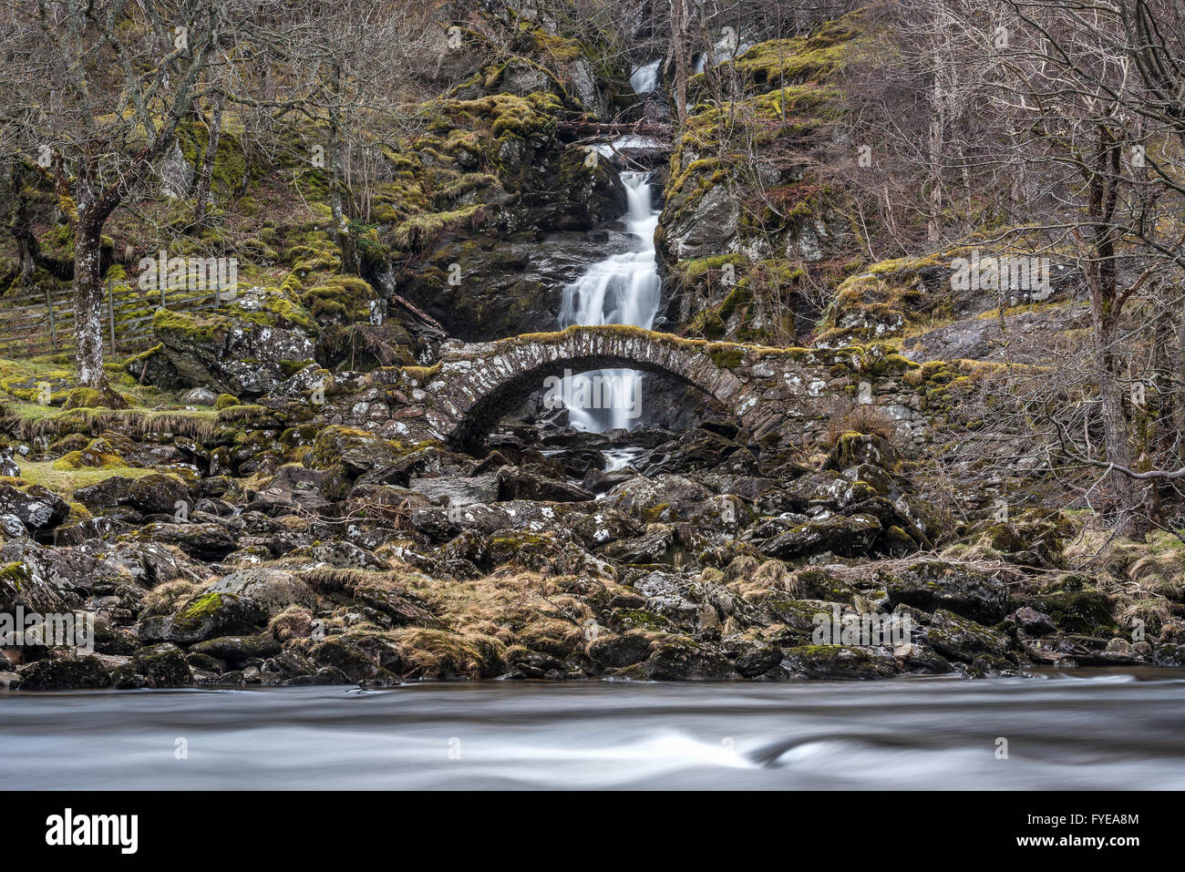 The Roman Bridge in Glen Lyon Scotland, an old packhorse bridge on the road through the glen. Stock Photo