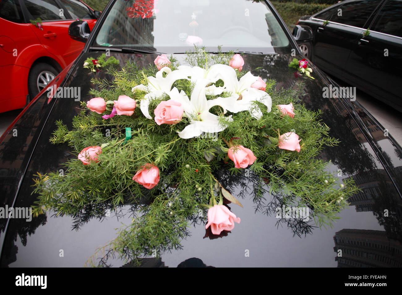 Closeup view on flower decoration on modern wedding car Stock