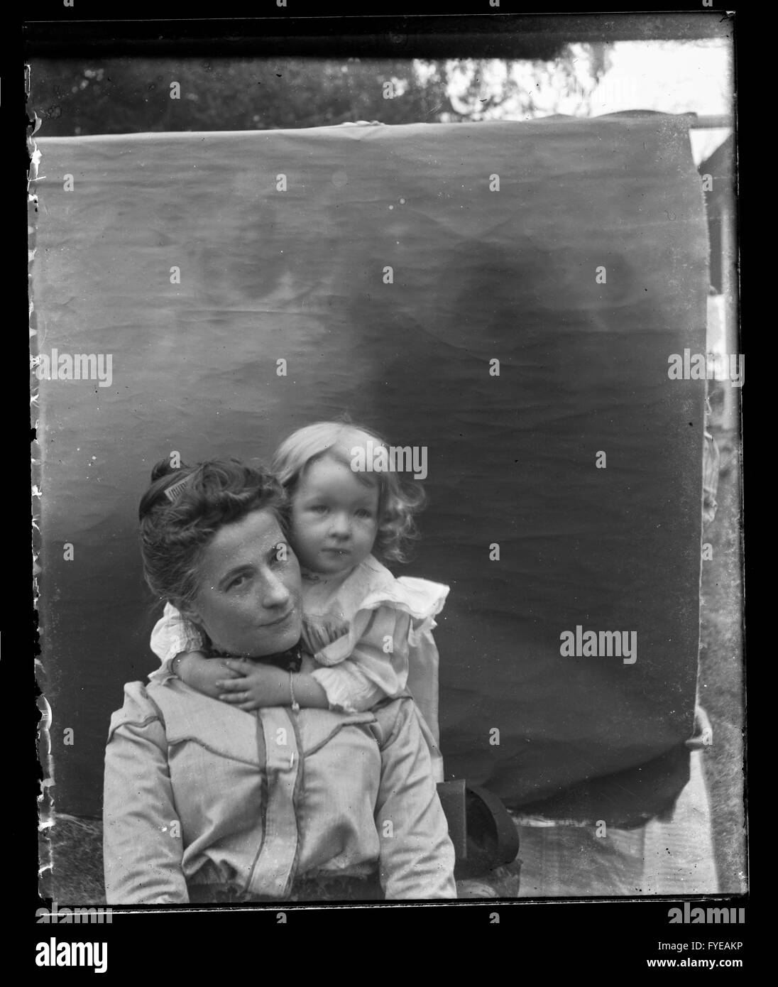 Victorian photograph of a woman and child having their portrait taken. Stock Photo