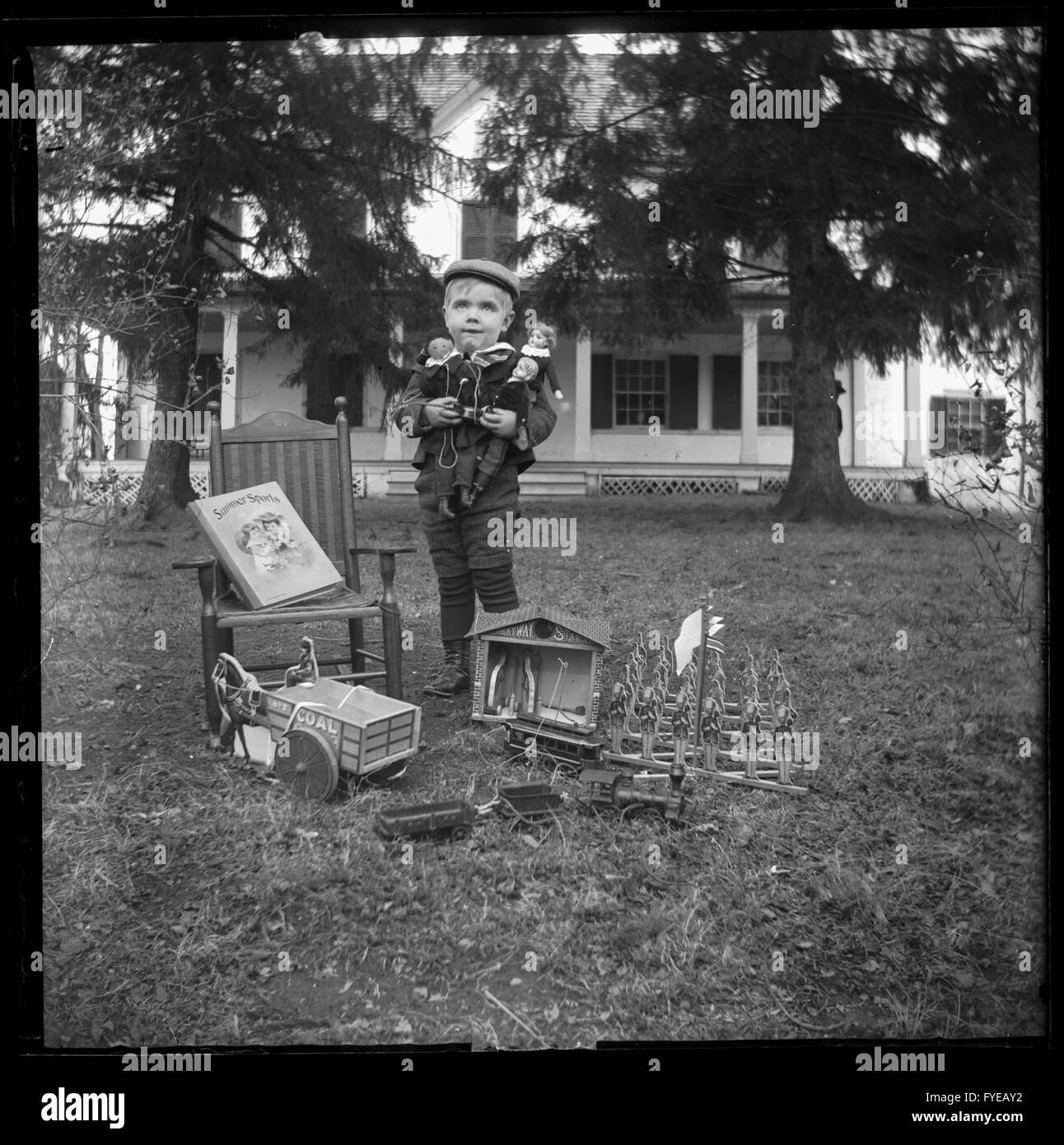 Victorian photograph of a boy with his Christmas gifts in Fallston, Maryland. Stock Photo