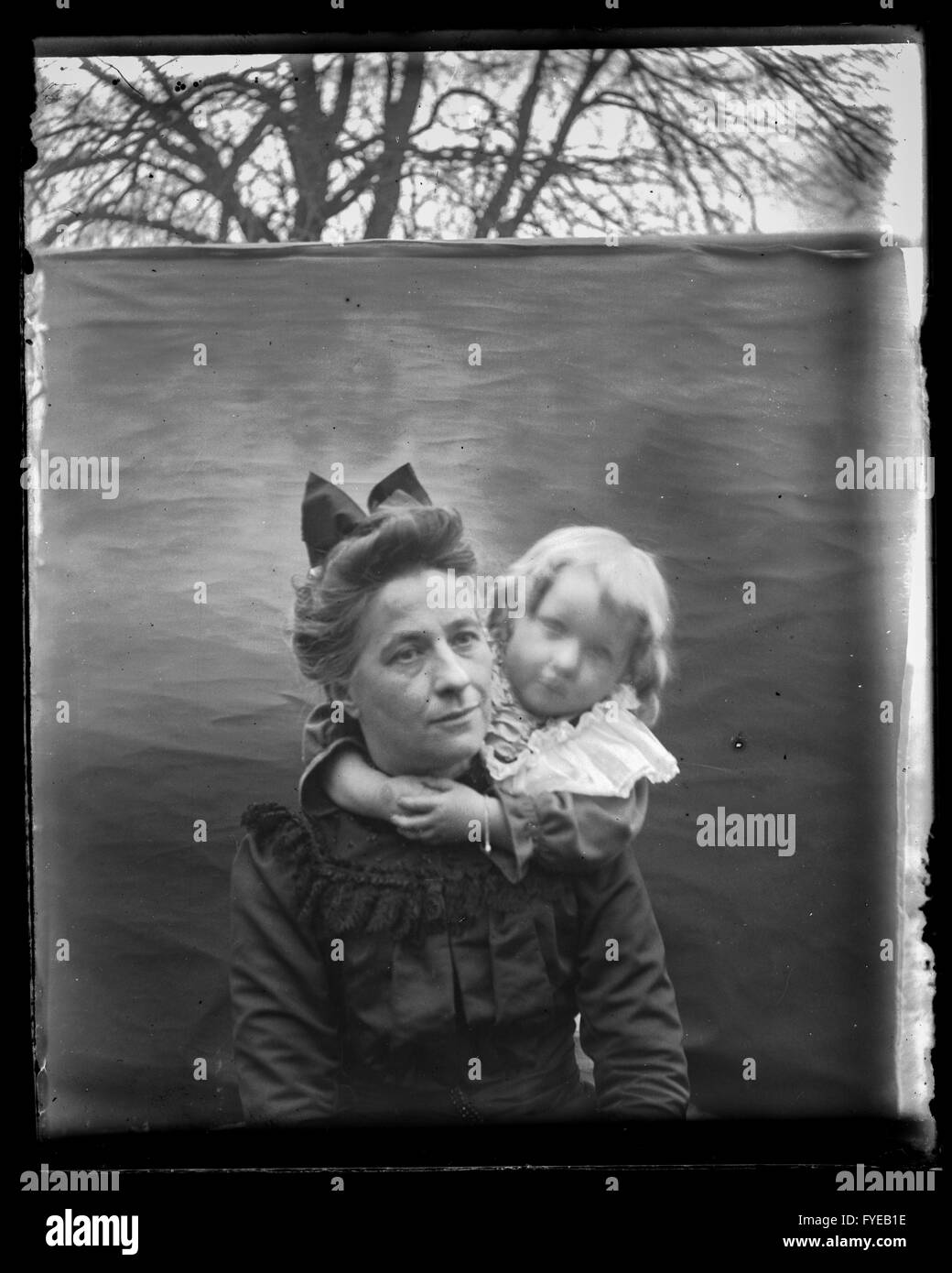 Victorian photograph of a woman and young child having their portrait taken. Stock Photo