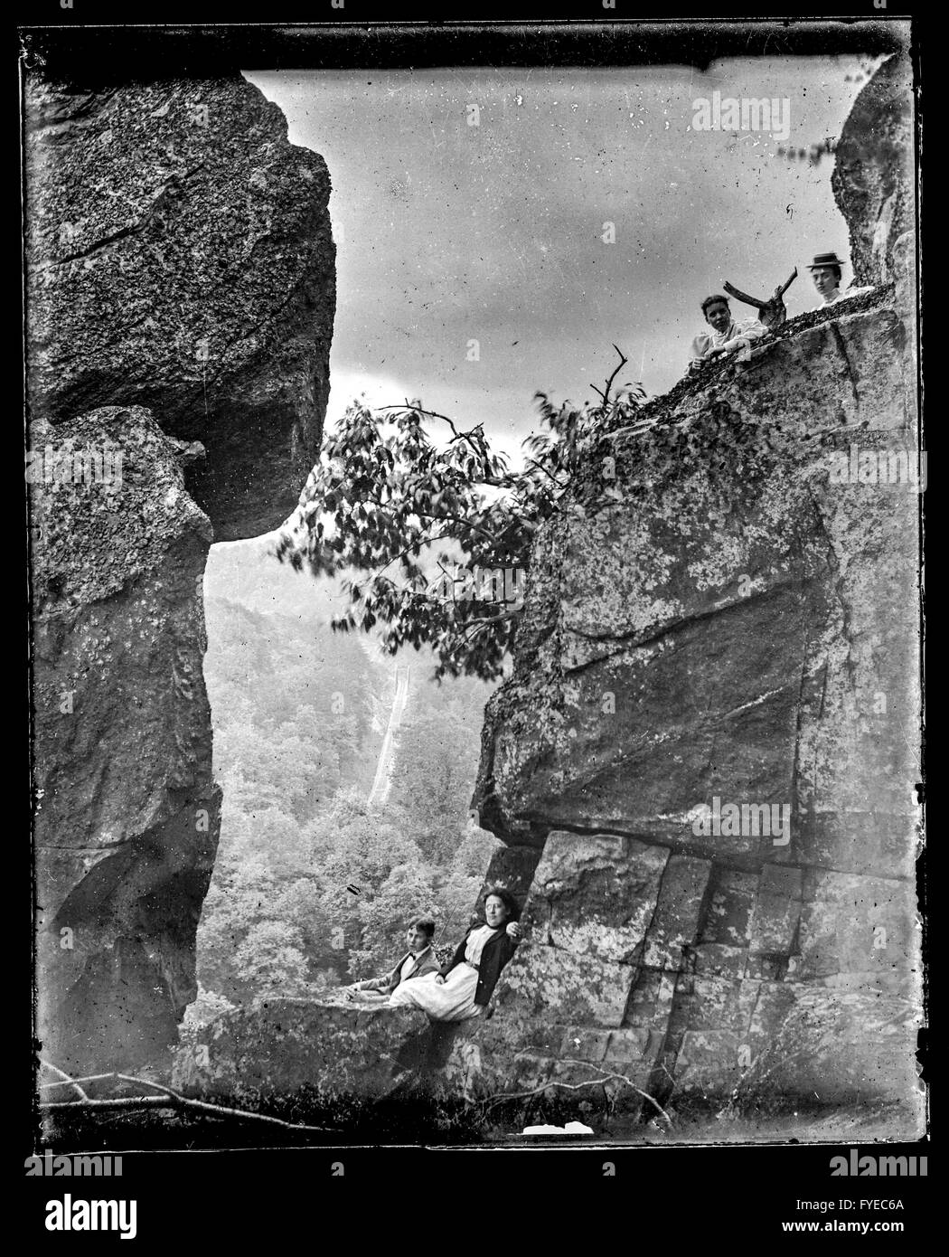 Victorian photograph of people sitting on large rocks outside in Fallston, Maryland. Stock Photo