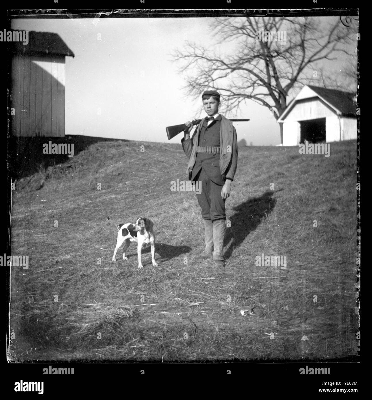Victorian photograph of a boy with his hunting dog and gun on a farm in Fallston, Maryland. Stock Photo