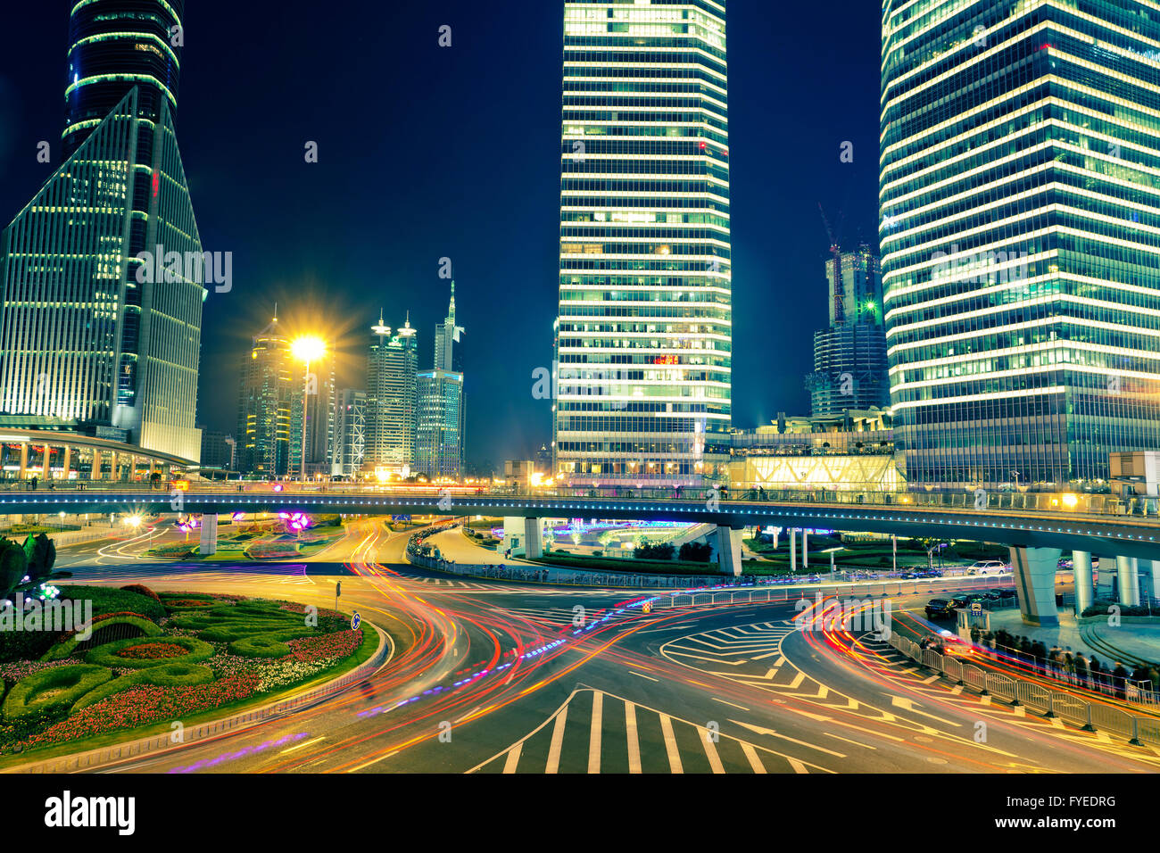the light trails on the modern building background Stock Photo - Alamy