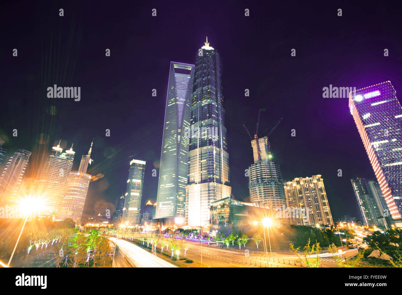 the light trails on the modern building background Stock Photo - Alamy
