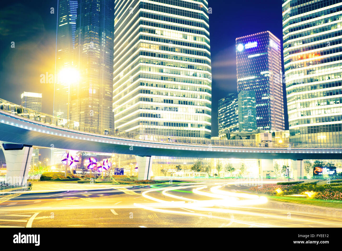 the light trails on the modern building background Stock Photo - Alamy