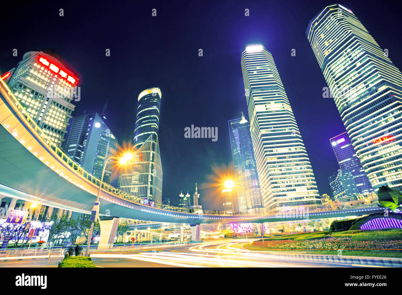 the light trails on the modern building background Stock Photo - Alamy