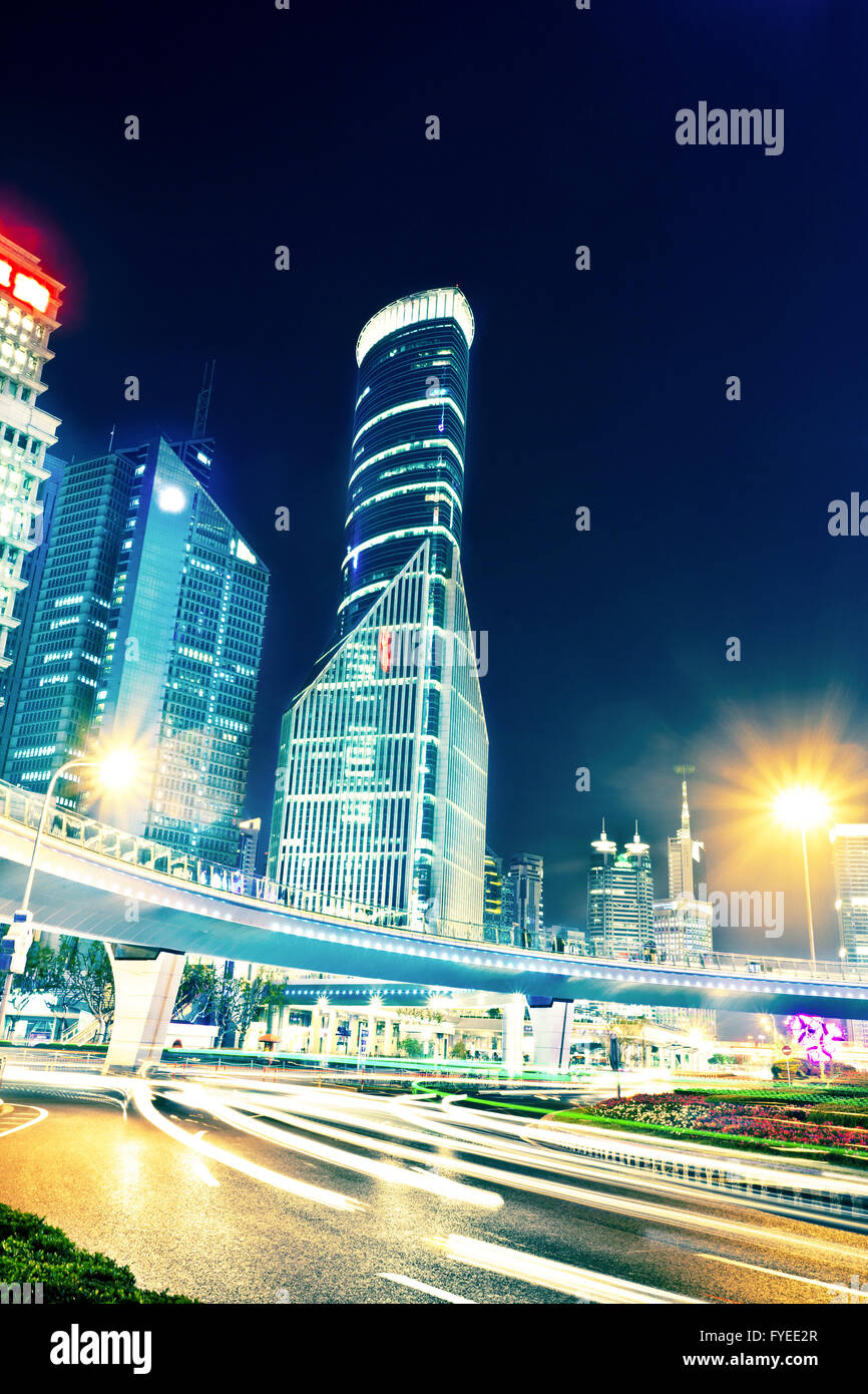 the light trails on the modern building background Stock Photo - Alamy