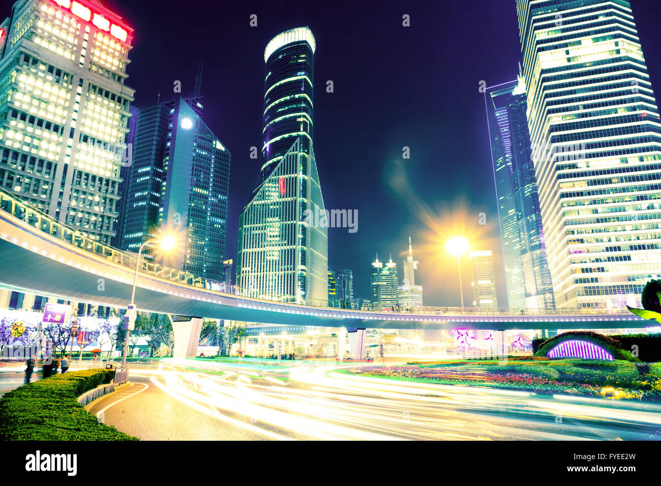 the light trails on the modern building background Stock Photo - Alamy