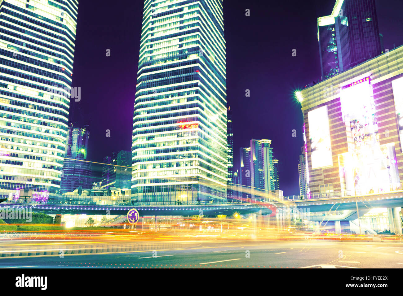 the light trails on the modern building background Stock Photo - Alamy