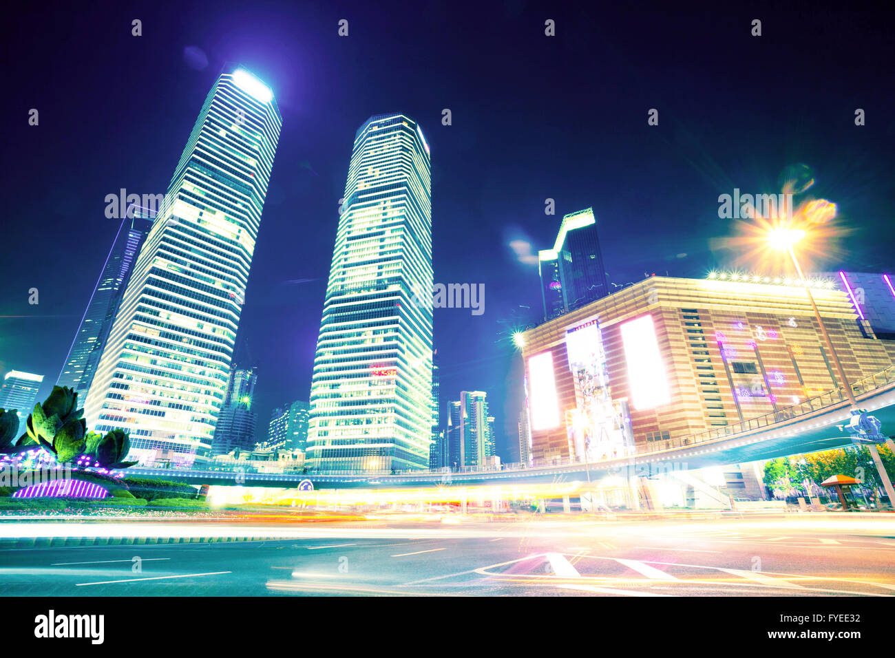 the light trails on the modern building background Stock Photo - Alamy