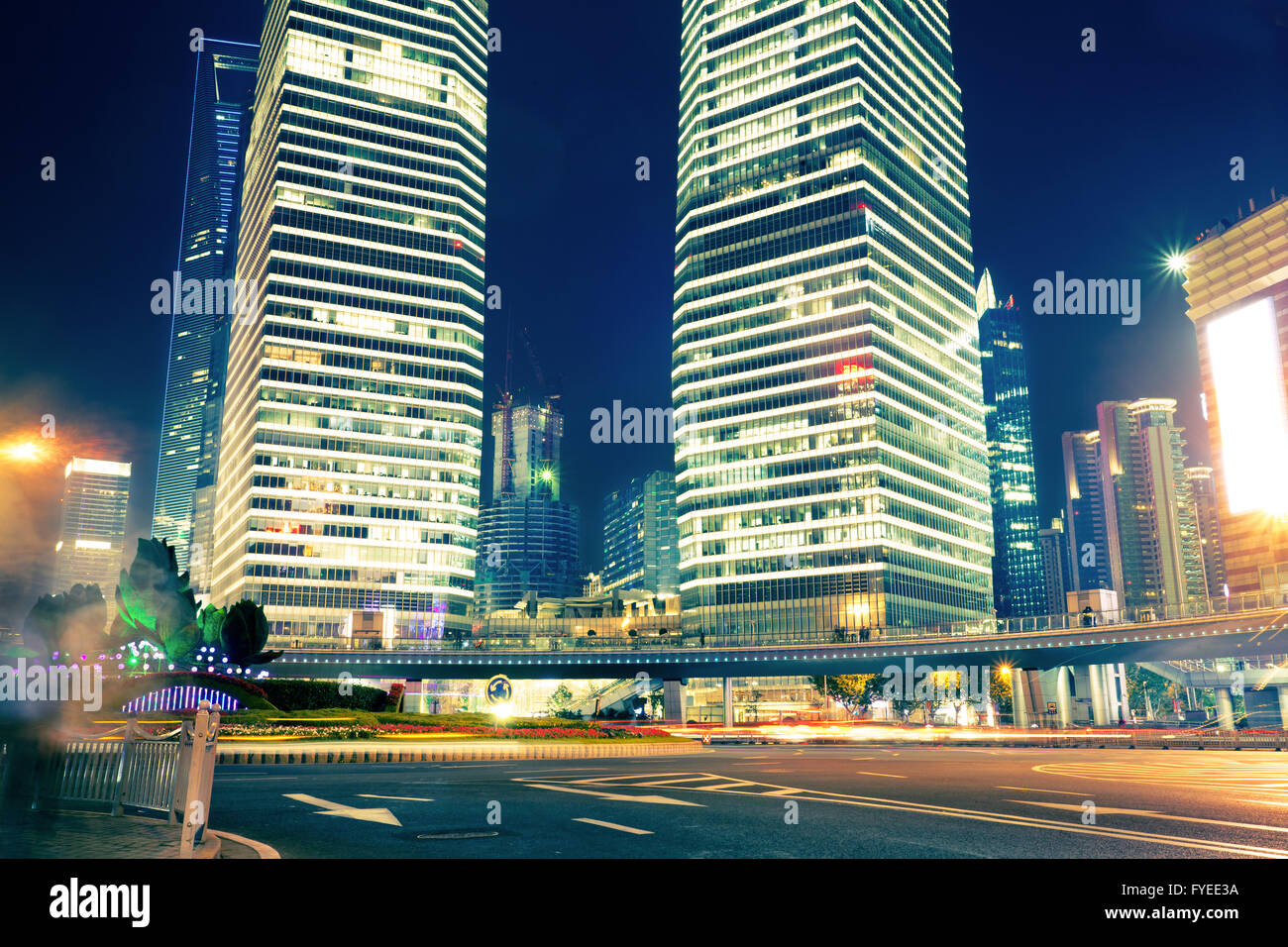 the light trails on the modern building background Stock Photo - Alamy