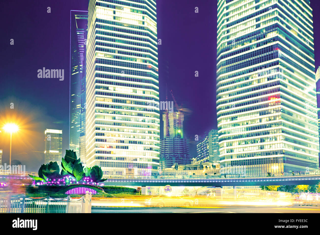 the light trails on the modern building background Stock Photo - Alamy
