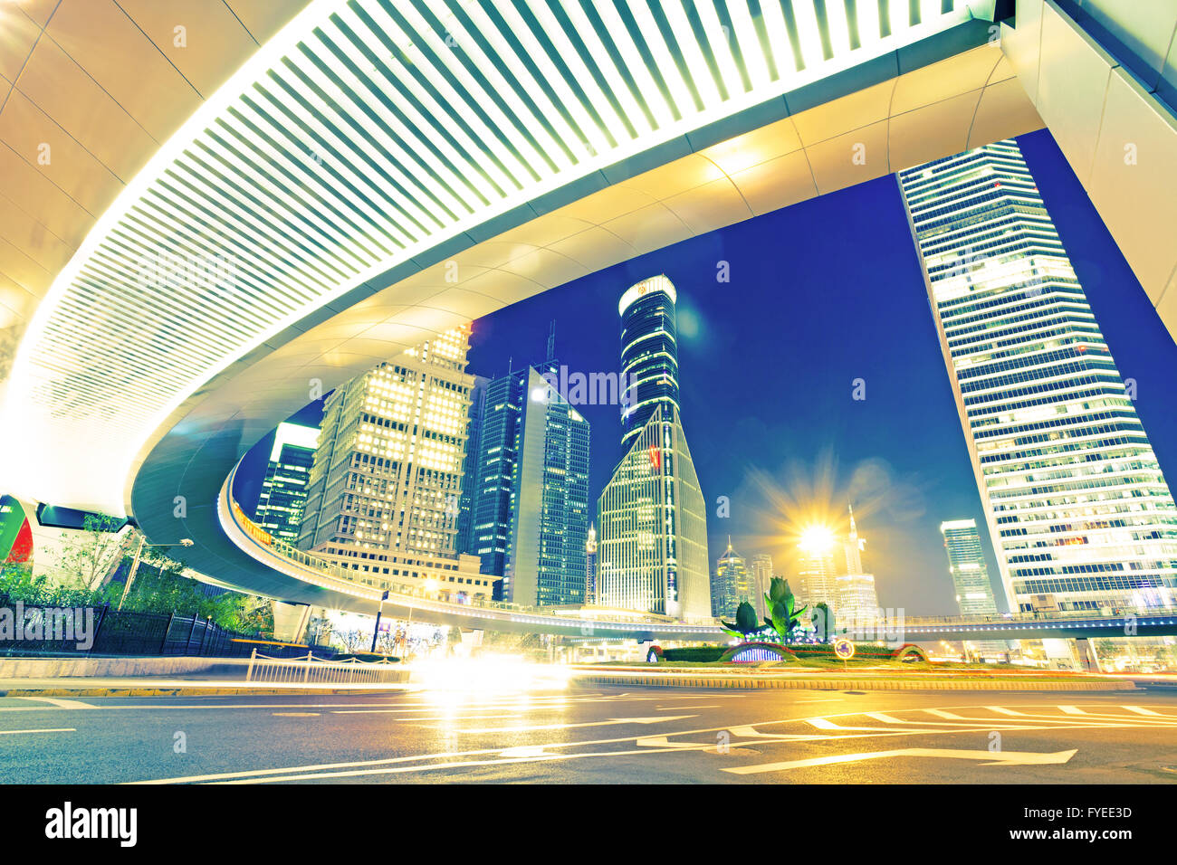 the light trails on the modern building background Stock Photo - Alamy
