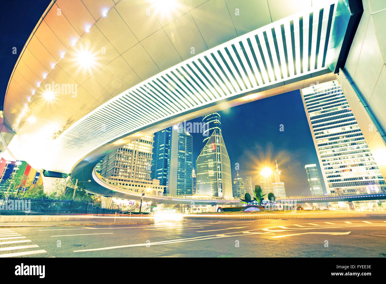 the light trails on the modern building background Stock Photo - Alamy