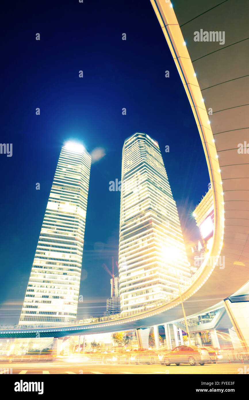 the light trails on the modern building background Stock Photo - Alamy