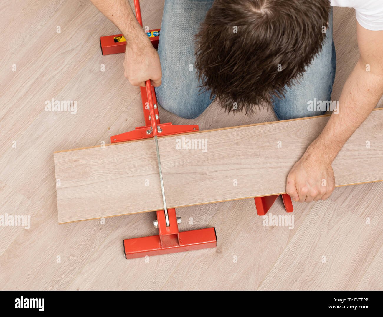 Red Tool For Cutting Laminate On A Laminate Floor Stock