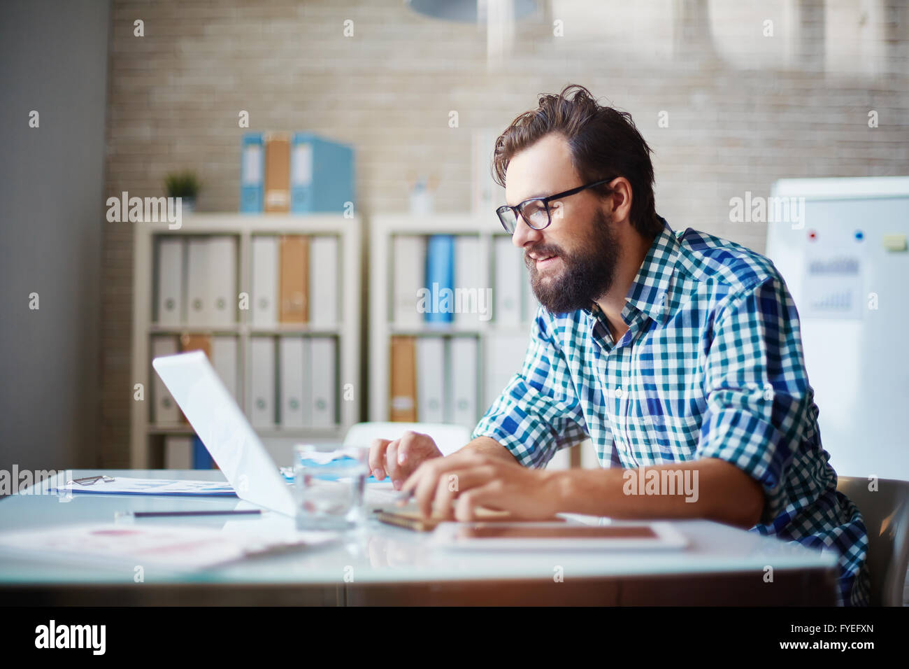Young bearded man laptop hi-res stock photography and images - Alamy