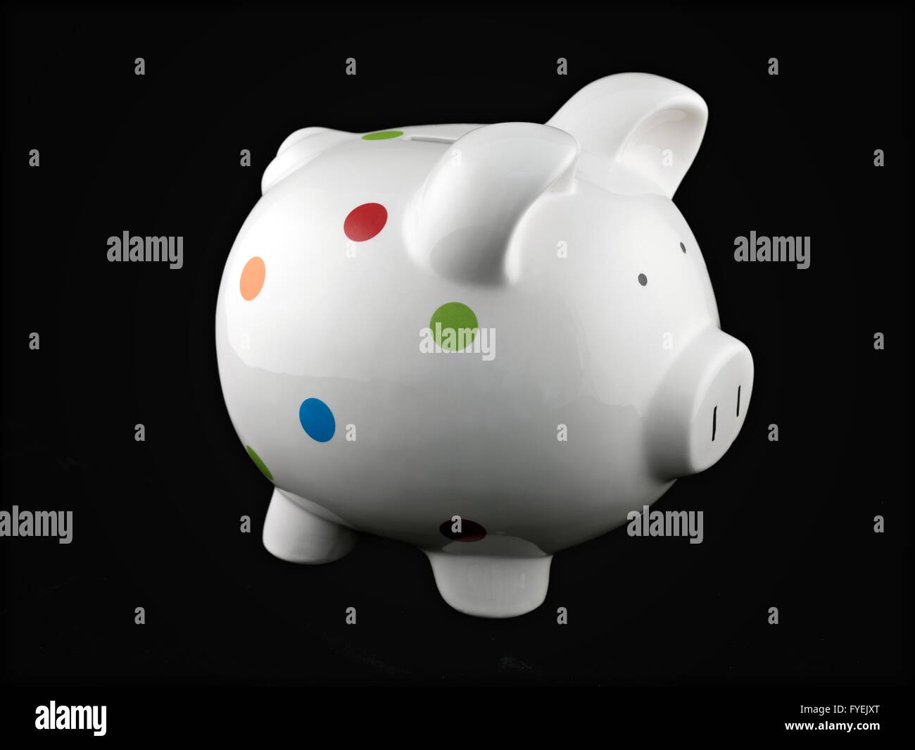 A piggy bank isolated against a black background Stock Photo