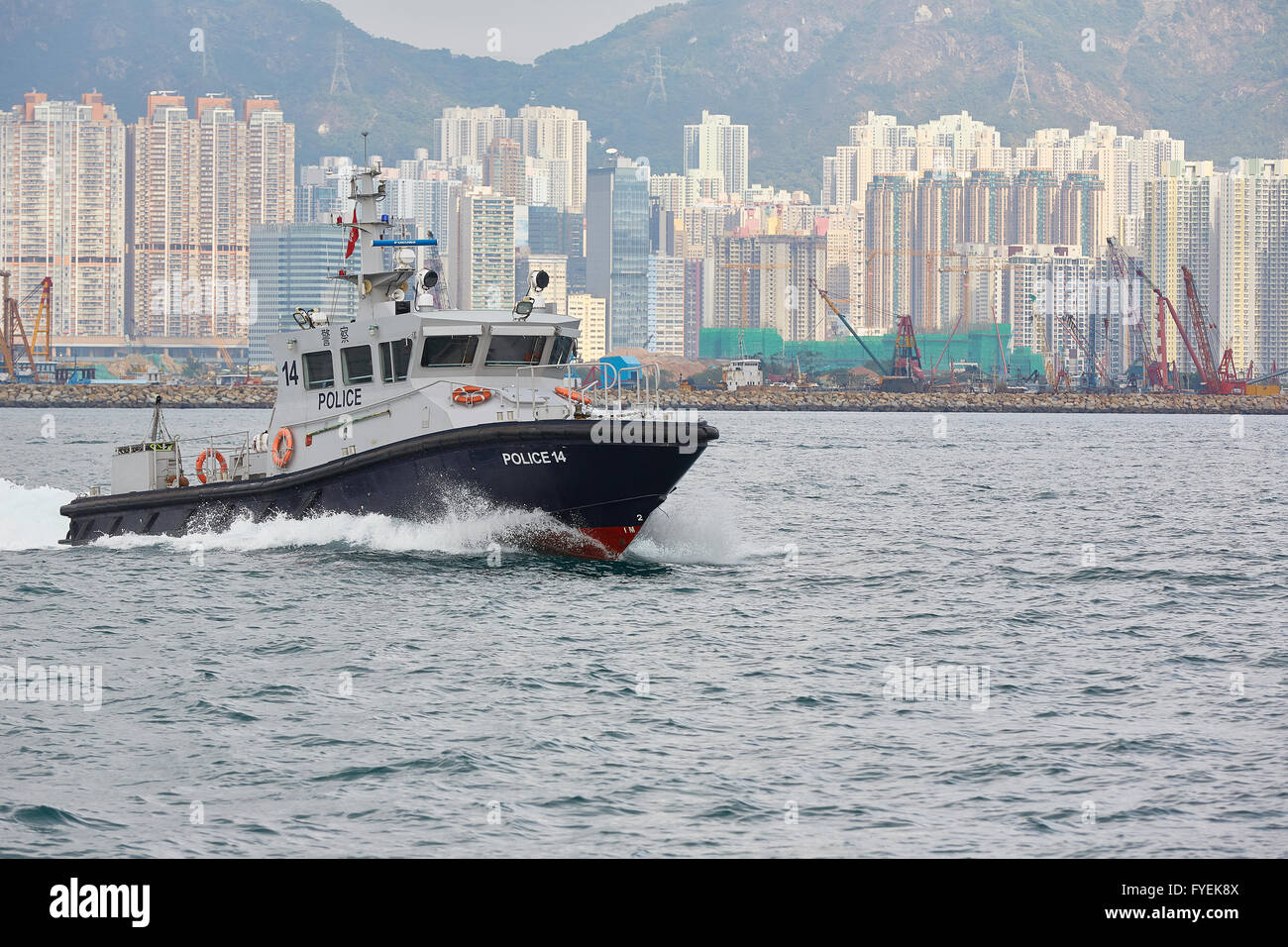 Hong Kong Police Patrol Boat Crosses Kowloon Bay, Hong Kong. Stock Photo
