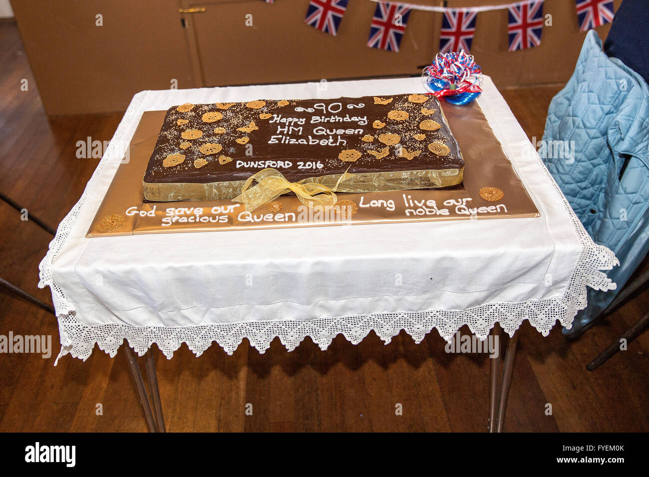 Queen Elizabeth 2 cake,god save the queen, Queen Elizabeth 2,village hall, chairs, decoration, table, floor, light, old, village Stock Photo