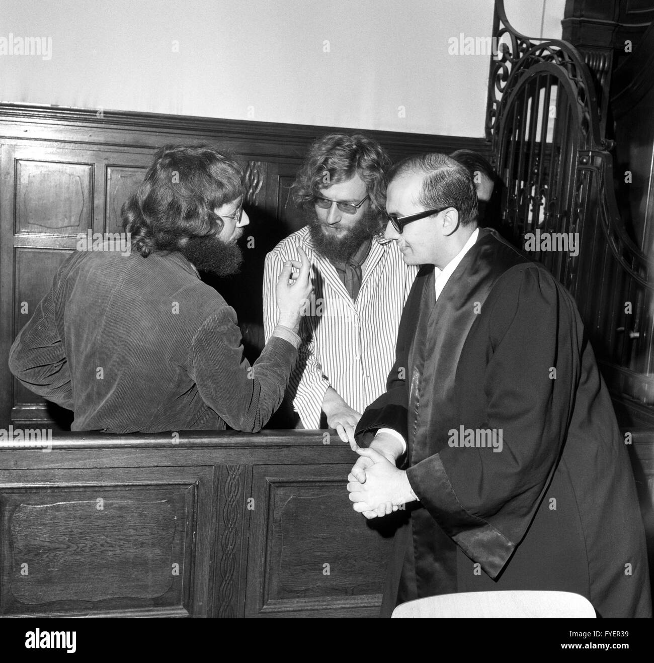 The defendants Fritz Teufel and Jörg Schlotter (l-r) and lawyer Horst Mahler. The process because of trespass against Teufel and Schlotterer, who had not appeared to an earlier date and and therefore had been arrested, started on 03 October 1968 in Berlin. Teufel stated - ironically - that he regretted his transgressions deeply and wanted to be punished with three to five years of prison. His fellow defendent Schlotterer was a 'disgusting anarchist' and his lawyer Mahler should be put into prison. Stock Photo