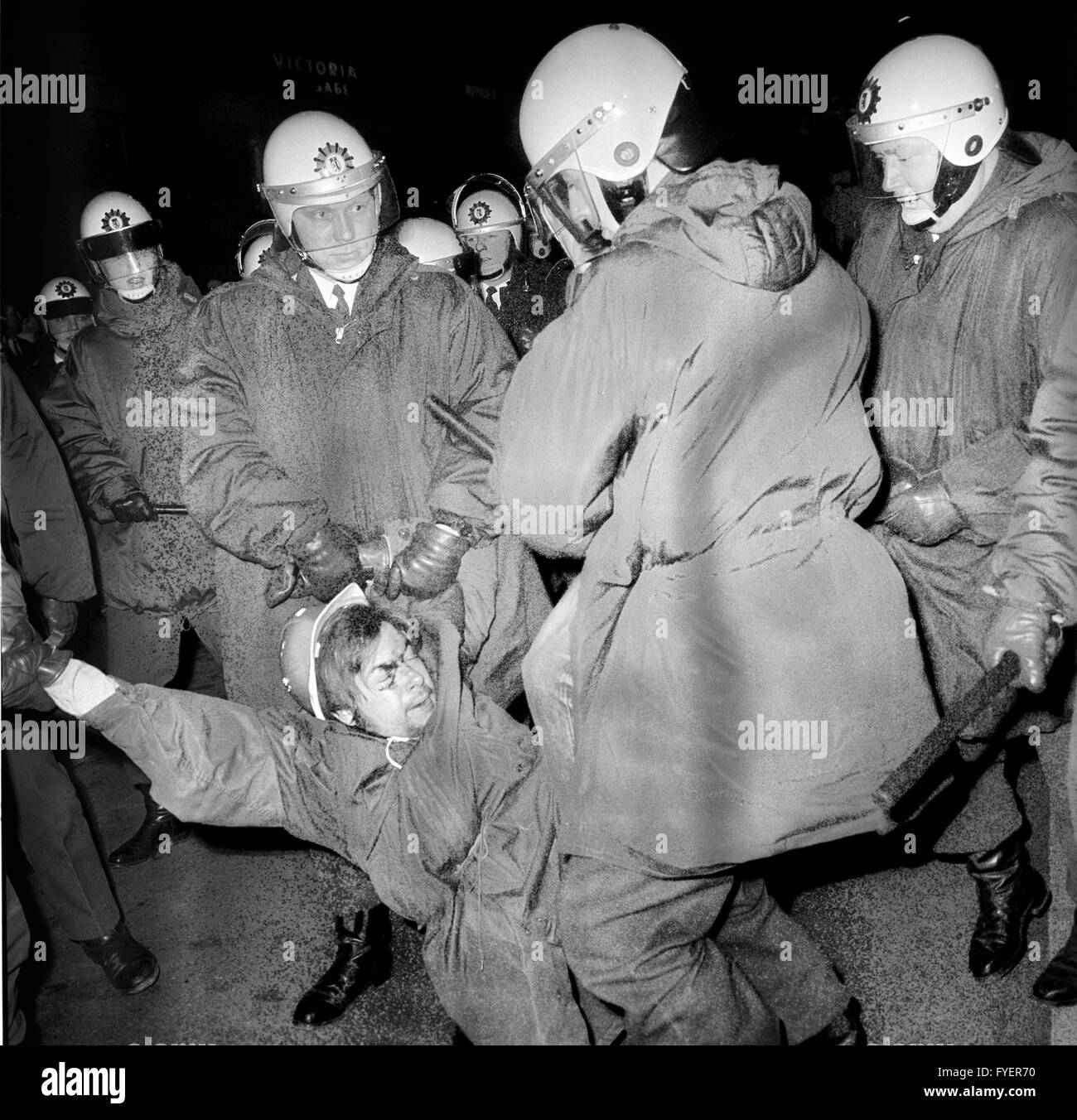 Policemen carry away a demonstrator during a demonstration against the NPD (National Democratic Party of Germany) on 04 March 1969 in Berlin. Stock Photo