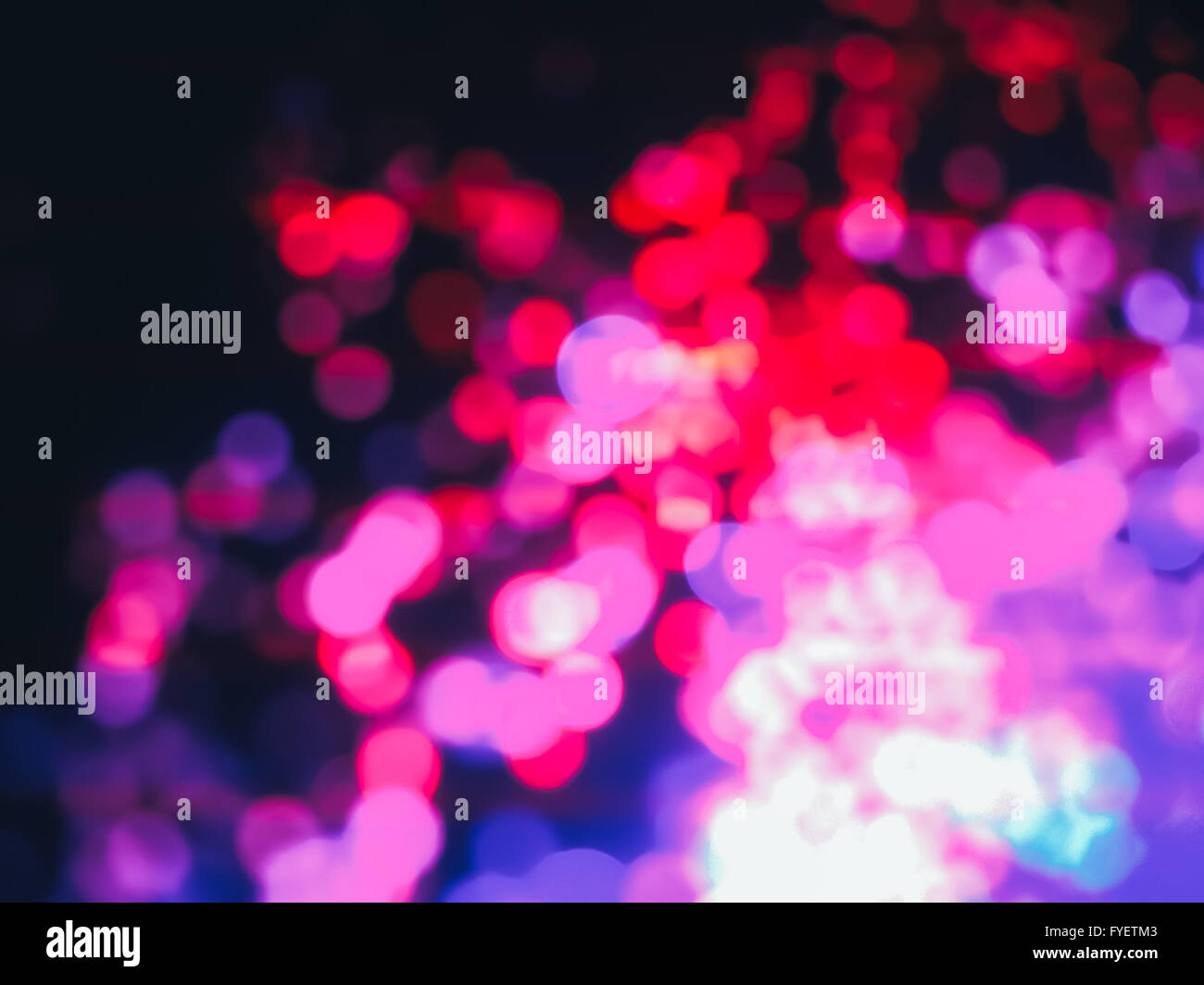 Colorful bokeh lights on a dark background. Stock Photo