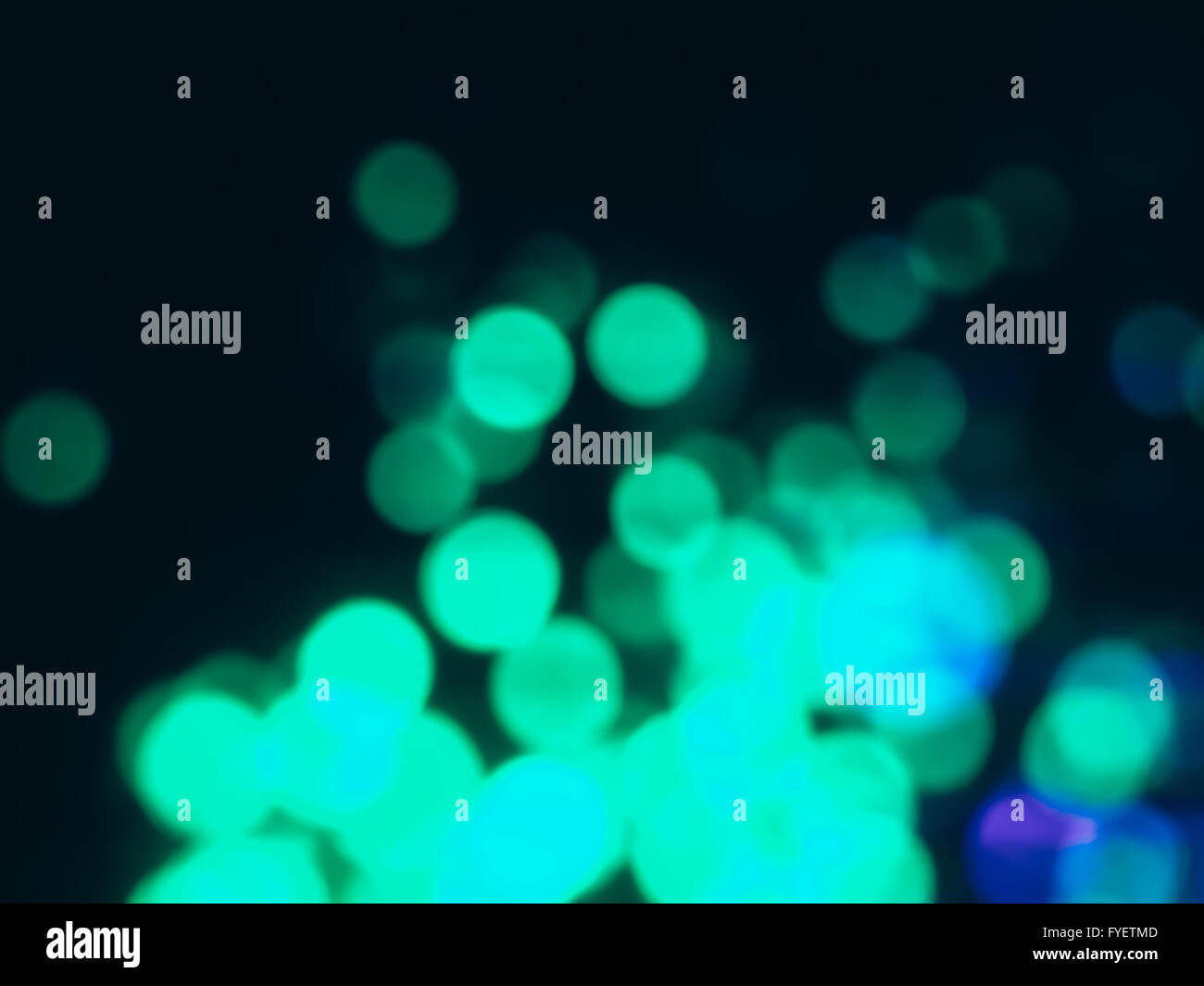 Colorful bokeh lights on a dark background. Stock Photo