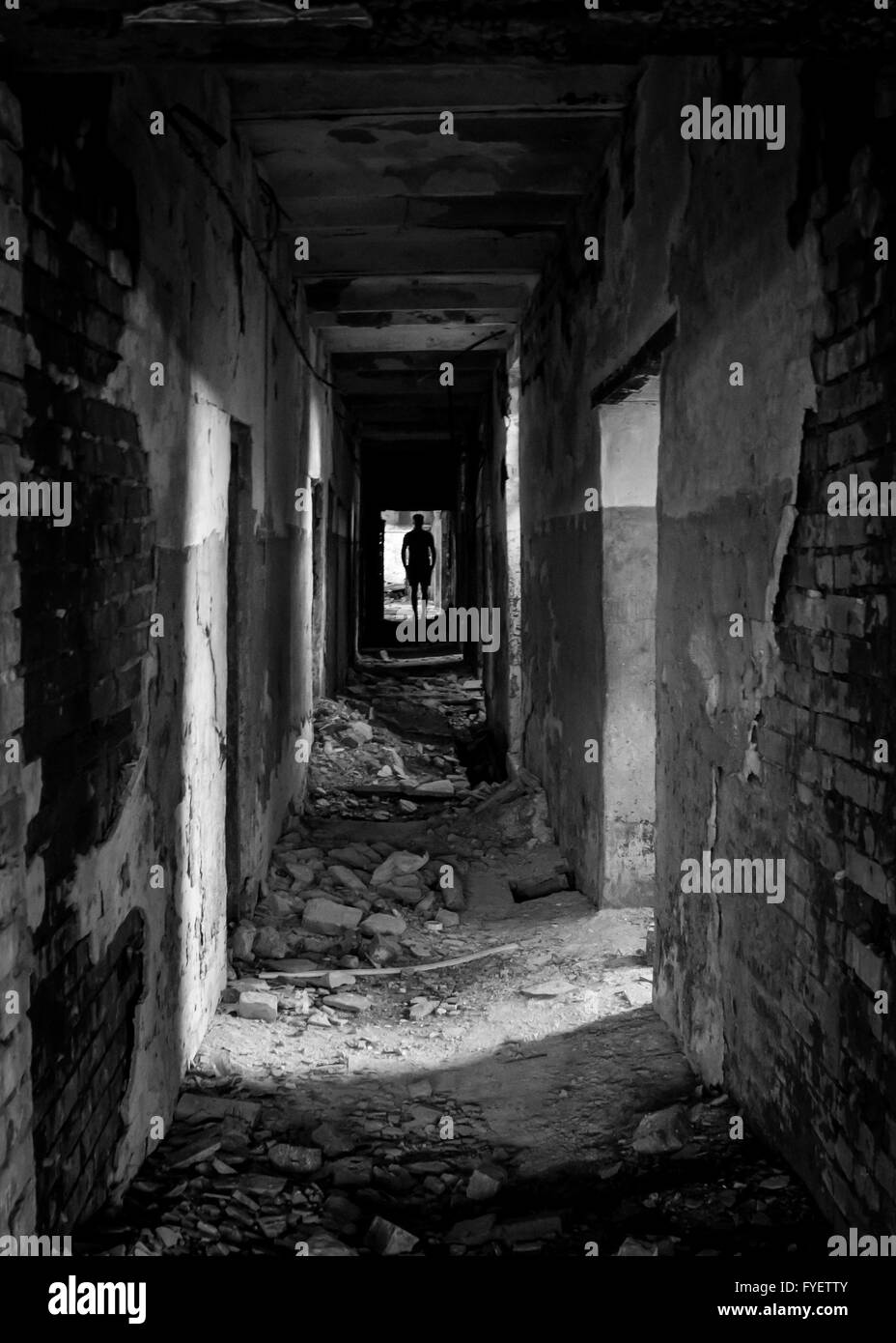 Destroyed at the end of the corridor which is a man. Stock Photo