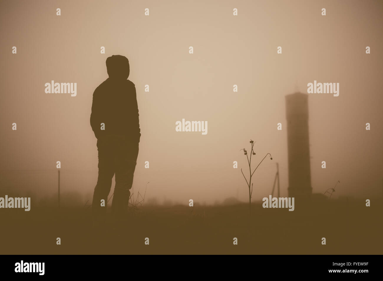 Silhouette of the person and tower. Stock Photo