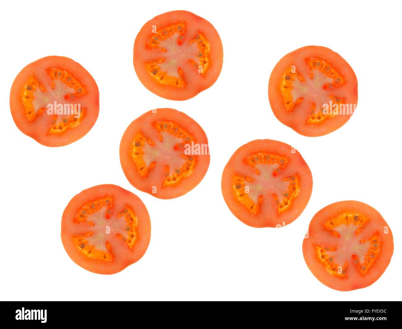 Sliced tomatos isolated against a white background Stock Photo - Alamy