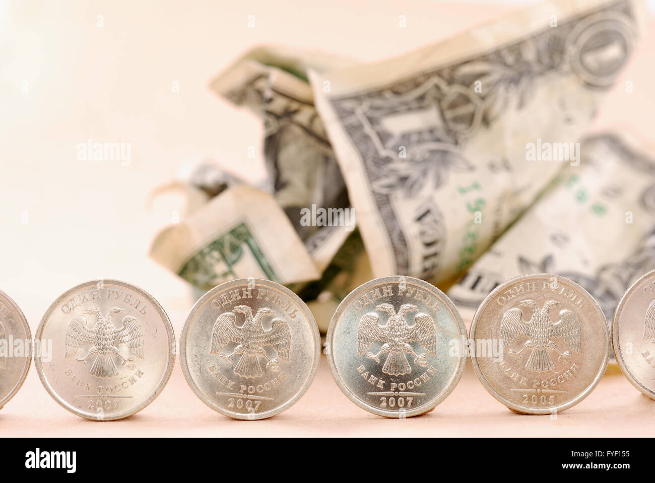 Crumbpled dollars under coin protection Stock Photo