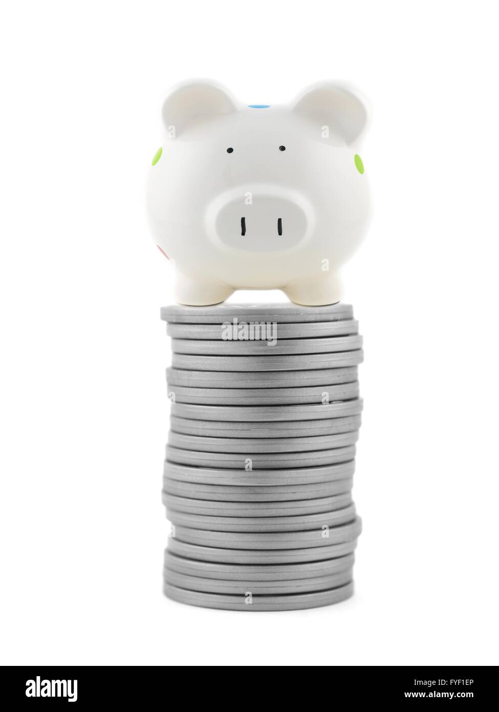 Silver play money with a piggy bank isolated against a white background Stock Photo