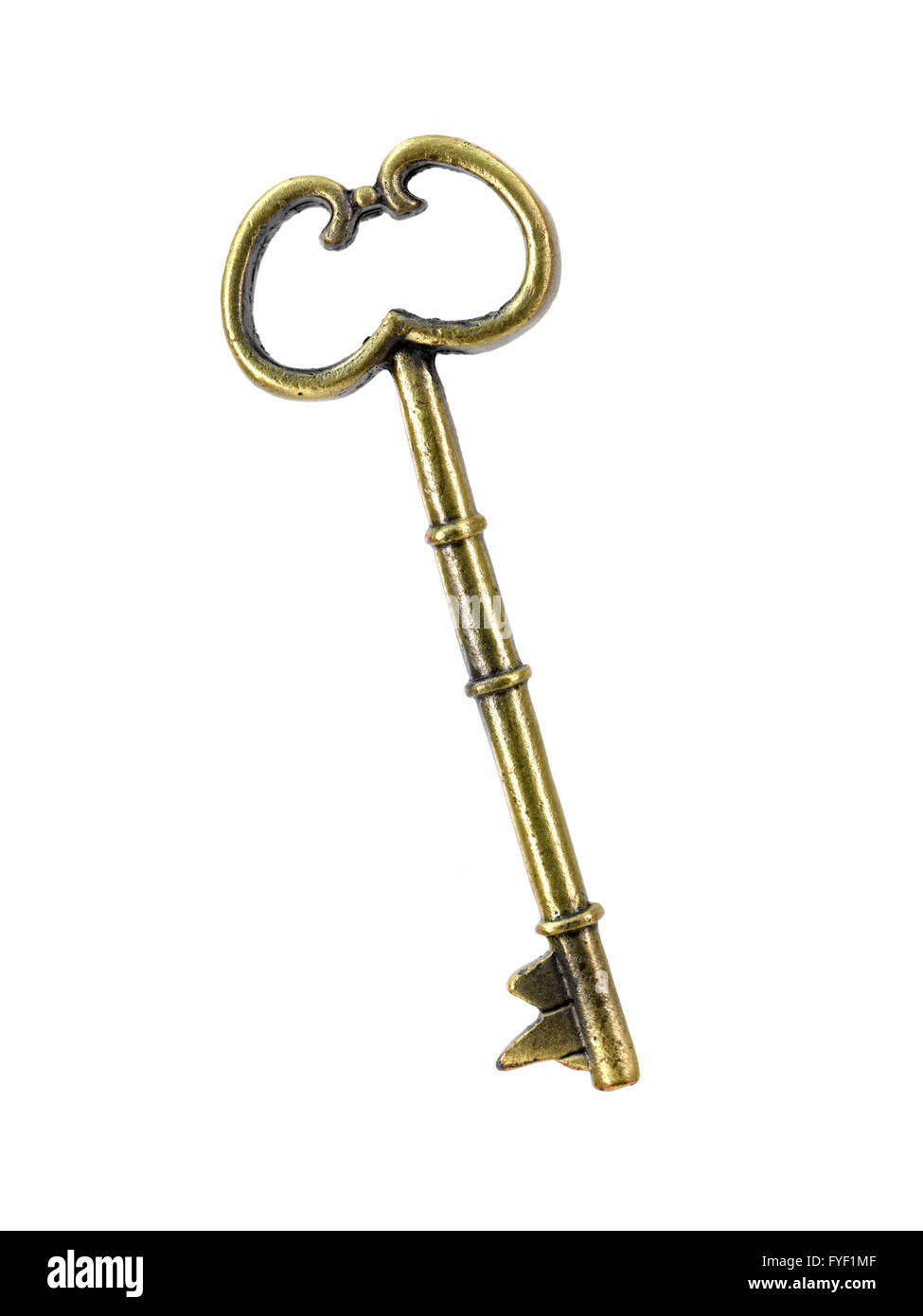 A vintage brass key isolated against a white background Stock Photo Alamy