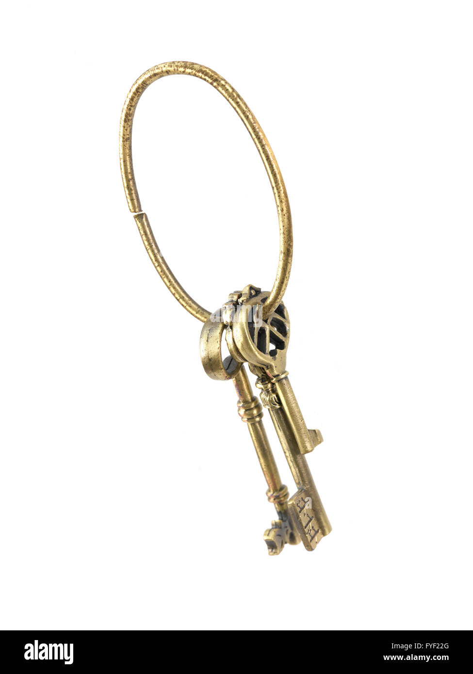 Vintage brass keys isolated against a white background Stock Photo Alamy