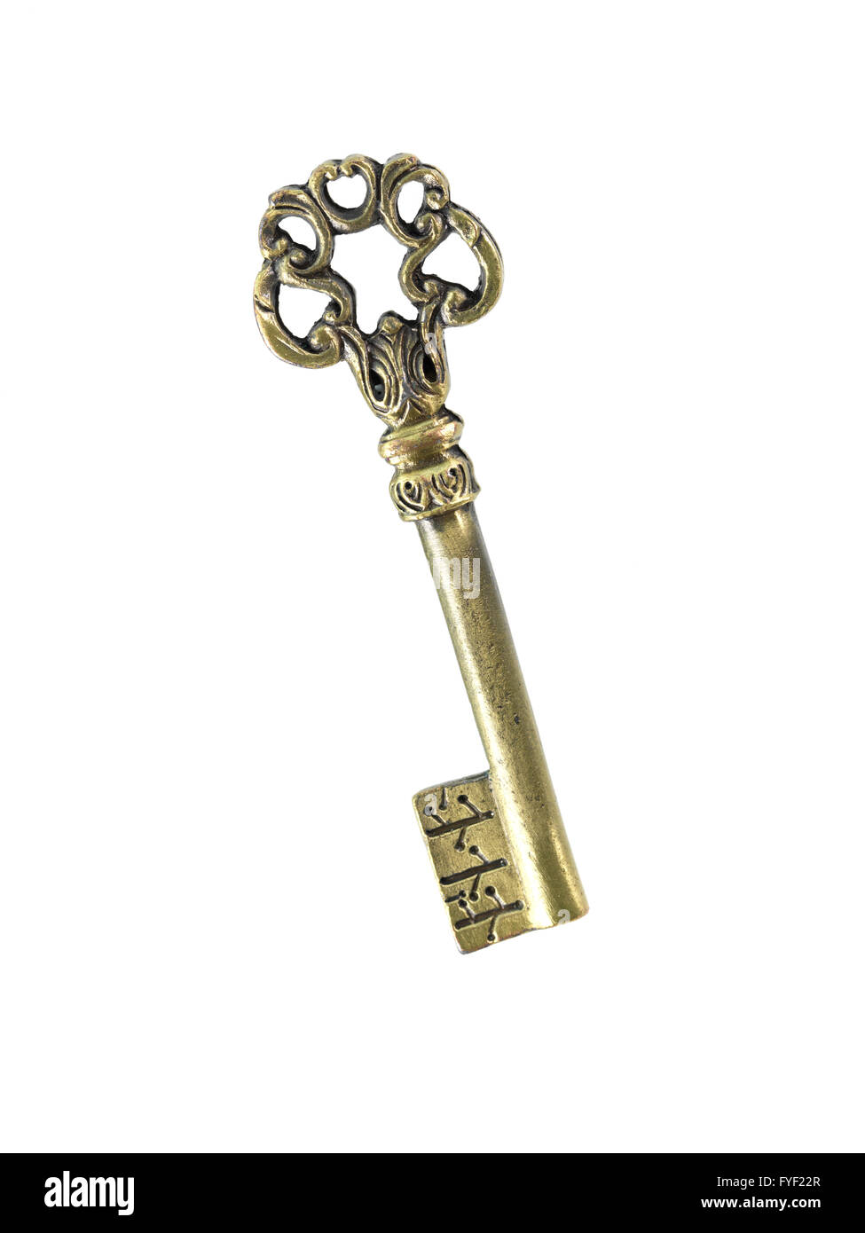 A vintage brass key isolated against a white background Stock Photo Alamy